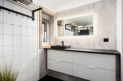 a bathroom with a sink and a mirror at Kvitsand Ocean Castle in Hitra