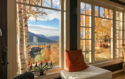 a room with a large window with a view at 2 Bedroom Lovely Home In Oppdal in Oppdal