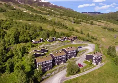 an aerial view of a house in a mountain at Fjellleilighet med drømmeutsikt in Oppdal