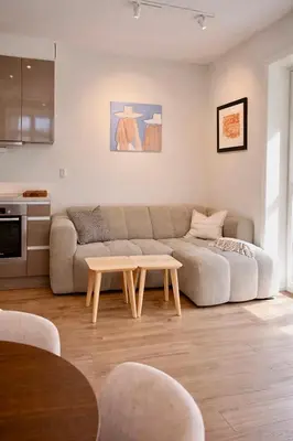 a living room with a couch and a table at Central apartment in Bergen