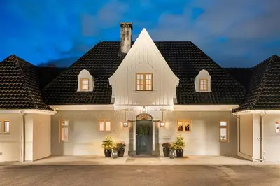 a large white house with a large roof at Exclusive Villa - Scandinavian Luxury At Its Best in Bergen