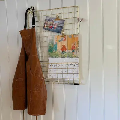 a leather jacket and a calendar hanging on a wall at 047 Farmhouse - Nevlunghavn in Lii