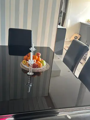 a bowl of fruit on a table with a cross at Scandinavian Style Ridabu Hamar in Hamar
