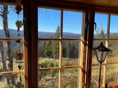 a window with a view of a mountain view at Thorpeset cabin by Norgesbooking - cabin with amazing view in Uvdal