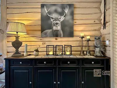 a painting of a deer hanging on a wall at Stylish log cabin in Hafjell with view & sauna in Hafjell