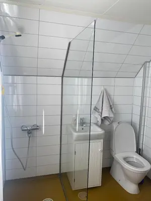 a small bathroom with a toilet and a sink at Cozy house closw in Lii