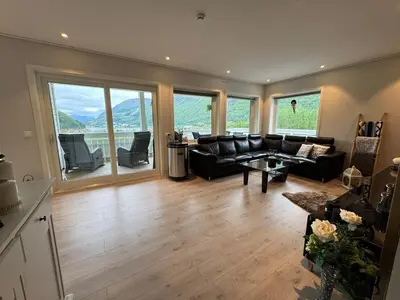 a living room with a couch and a table at Loen Panorama View in Loen