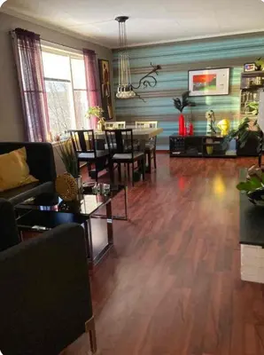 a living room with a couch and a table at Lilletun in Selbu