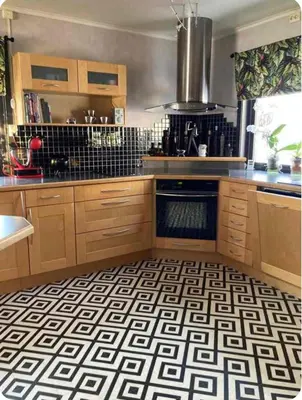 a kitchen with a black and white checkered floor at Lilletun in Selbu