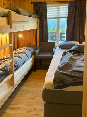 two bunk beds in a room with a window at Family-Friendly Mountain Cabin In Haukeli in Nesland