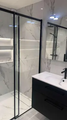 a bathroom with a sink and a glass shower at Trondheim in Trondheim