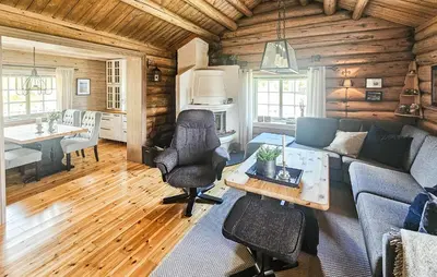 a living room with a couch and a table at 2 Bedroom Lovely Home In Nesbyen in Nesbyen