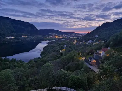 a view of a river with a town and a city at Cozy flat with lake view and 15 min from Bergen in Bergen