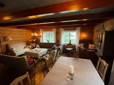 a living room with a couch and a table at Arnestova - villagehouse in Loen in Loen