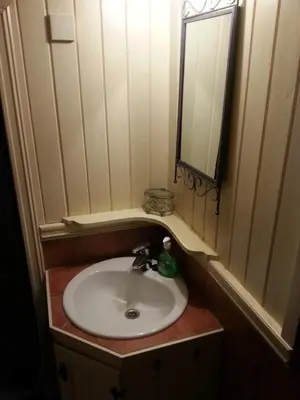 a bathroom with a sink and a mirror at Arnestova - villagehouse in Loen in Loen