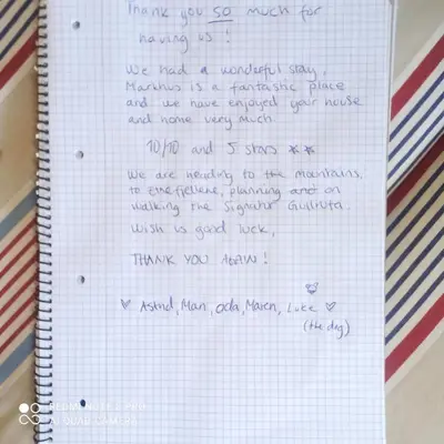 a notebook with handwriting on it on top at Markhus Apartment Near Langfoss in Markhus