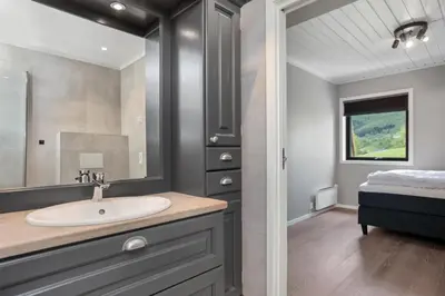 a bathroom with a sink and a mirror at Large nice apartment in Myrkdalen in Vossevangen