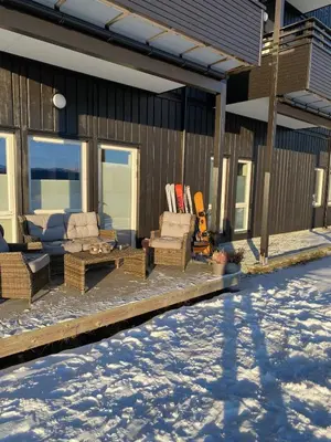 a porch of a house with snow on the ground at Ski in-Ski out with Mountain View at Voss in Vossevangen