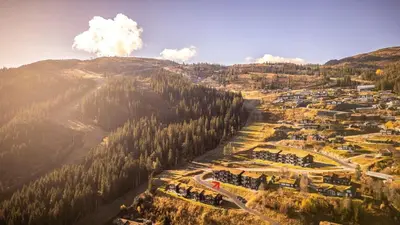 an aerial view of a village in the mountains at Ski in-Ski out with Mountain View at Voss in Vossevangen