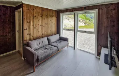 a living room with a couch and a window at Nice Home In Hafslo With Wifi in Hafslo