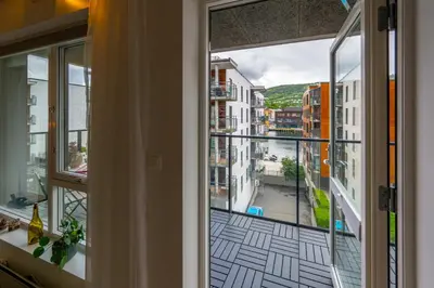 a view of a city from a window at Roomsly Apartments - City flat with Private Balcony in Bergen