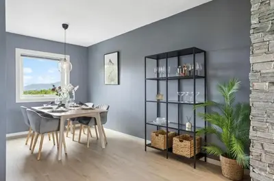 a dining room with a table and a shelf at Downtown apartment with a view in Bergen