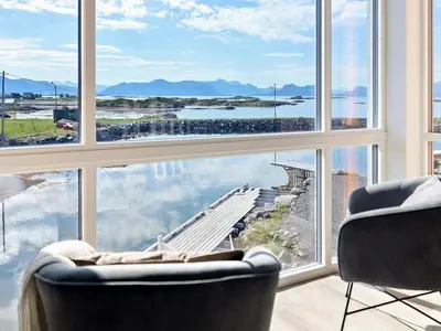 a living room with a large window with a view at 8 person holiday home in Sandøy in Finnøy