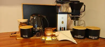 a counter with a coffee maker and a blender at Bright & Spacious Apartment by the Sea, Free Parking, 10min to Airport, 12min to Ålesund in Ytterland