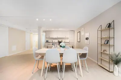 a kitchen and dining room with a table and chairs at Central stay apartment - 201 in Bergen