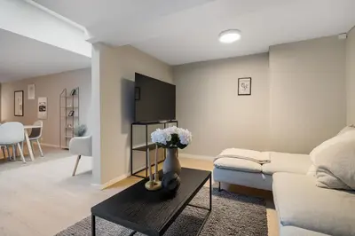 a living room with a couch and a table at Central stay apartment - 201 in Bergen