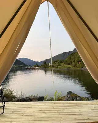 a tent with a view of a body of water at Ocean Glamping