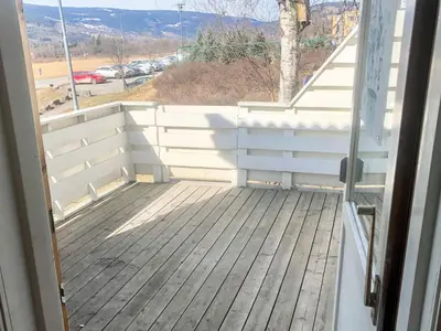 an open door to a deck with a view at 6 person holiday home in Lillehammer in Lillehammer