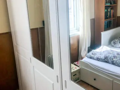 a bedroom with a mirror and a bed in it at 6 person holiday home in Lillehammer in Lillehammer