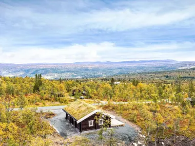 an overhead view of a small cabin with a grass roof at 8 person holiday home in Ålen in Ålen