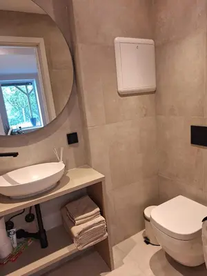 a bathroom with a sink and a mirror at Fjord Nest in Bergen