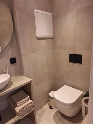 a bathroom with a toilet and a sink at Fjord Nest in Bergen
