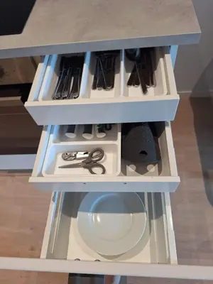 a drawer in a table with scissors and other items at Fjord Nest in Bergen