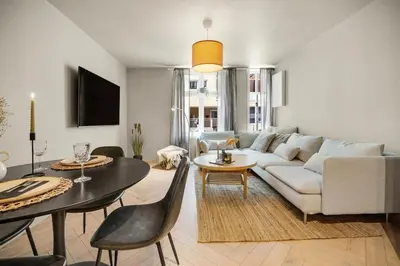 a living room with a couch and a table at Sentral leilighet i Bergen in Bergen