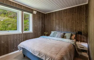 a bedroom with a bed and two windows at Amazing Home In Ål - With Wifi in Ål