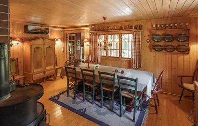 a dining room with a table and chairs at Awesome Home In Uvdal With Sauna in Uvdal