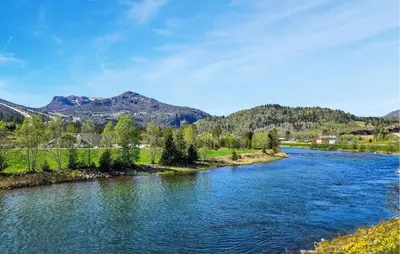 a river with trees and mountains in the background at Amazing Home In Hemsedal With Wifi in Hemsedal