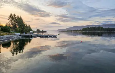 a view of a lake with a dock on the water at Cozy Home In Florø With Wifi in Florø
