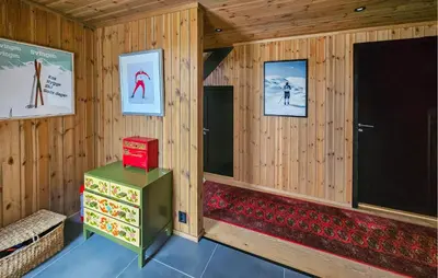 a room with wooden walls and a room with a door at Stunning Home In Nesbyen With Wifi in Nesbyen