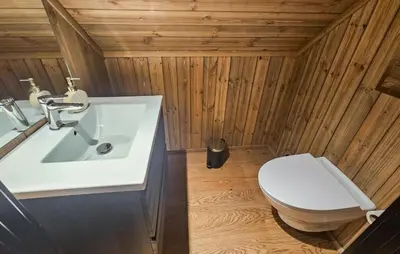 a bathroom with a white sink and a toilet at Stunning Home In Nesbyen With Wifi in Nesbyen