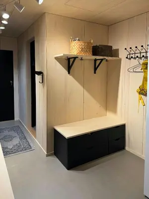 a room with a shelf and a bench on a wall at Modern Cabin Near Auersvatn And Ski Trails in Hovden