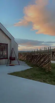 a basketball hoop in front of a building with a fence at Modern Cabin Near Auersvatn And Ski Trails in Hovden