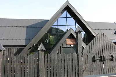 a building with a wooden fence in front of it at Stylish apartment in Hemsedal, Ski in-ski out in Hemsedal