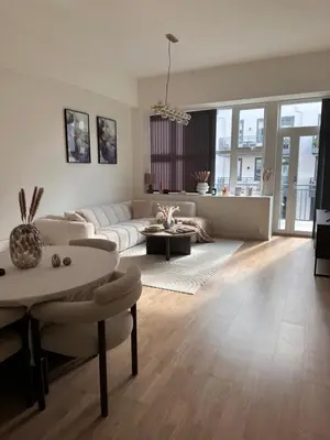 a living room with a couch and a table at ingen in Bergen