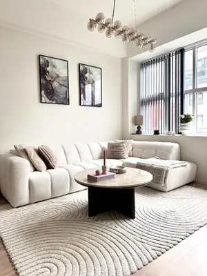 a living room with a white couch and a table at ingen in Bergen