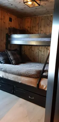 a room with two bunk beds in a cabin at Luxury Mountain Cabin Modern and Stylish in Uppheim